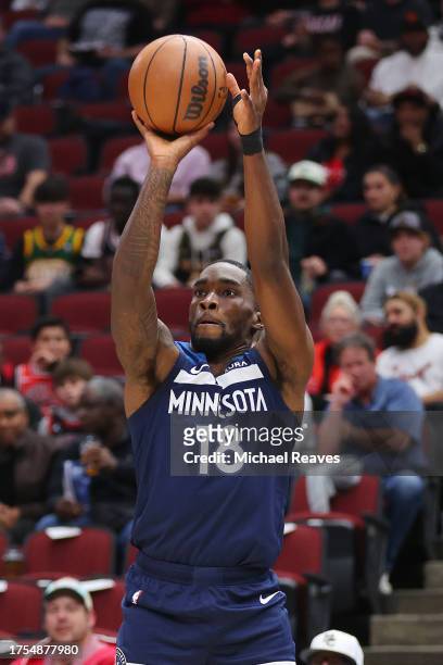 Shake Milton of the Minnesota Timberwolves shoots a three pointer against the Chicago Bulls during a preseason game at the United Center on October...