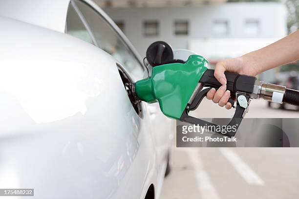 refueling at gas station - xxxxxlarge - bensin bildbanksfoton och bilder