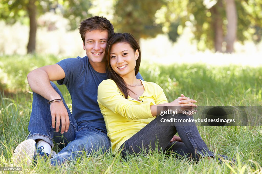Young Couple Relaxing In Countryside