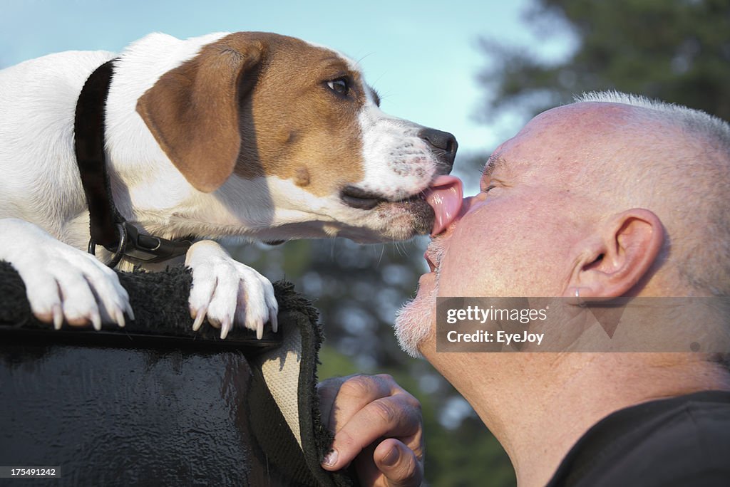 Dog Kissing Man