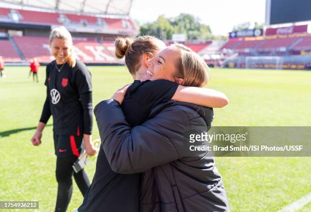 Becky Sauerbrunn of the United States hugs Amy Rodriguez after USWNT Training at America First Field on October 24, 2023 in Sandy, Utah.