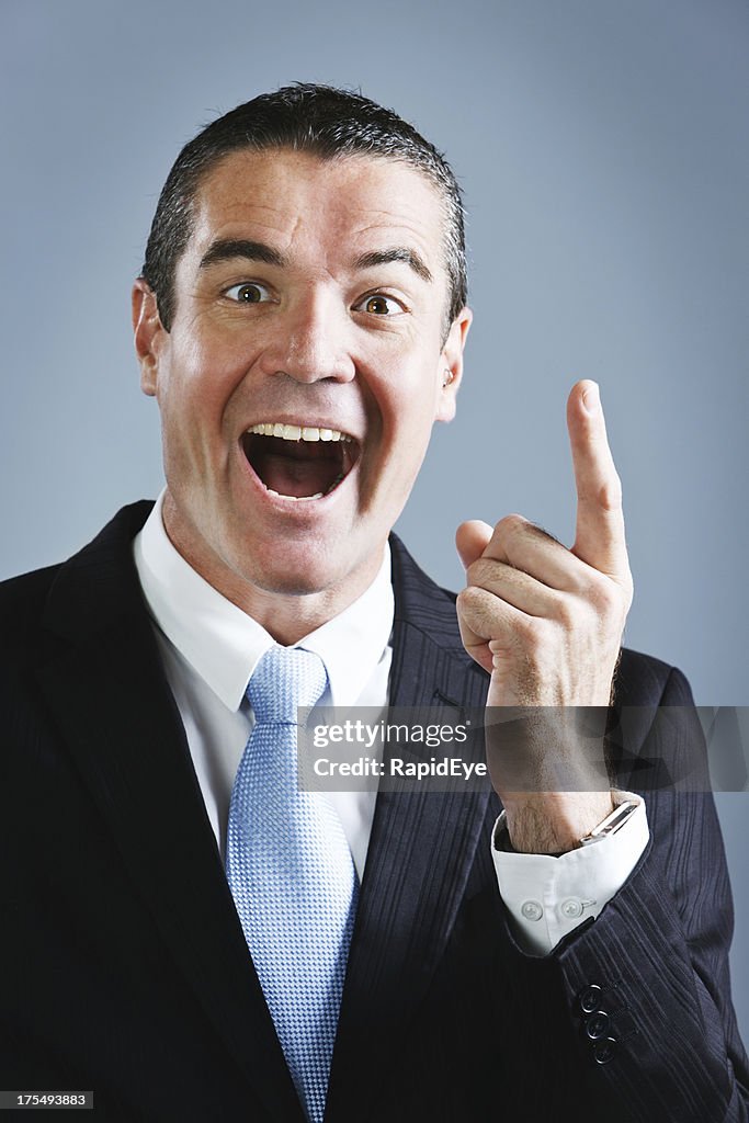 Handsome smiling businessman has a very bright idea