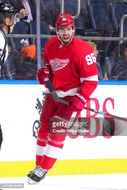 Jake Walman of the Detroit Red Wings celebrates after scoring a goal against the New York Islanders during the third period at UBS Arena on October...
