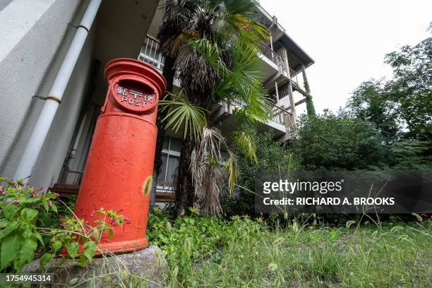This photo taken on September 20, 2023 shows an old style post box on the grounds of the former Ashigakubo Elementary School in the town of Yokose,...