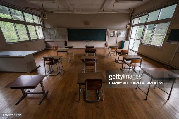 This photo taken on September 20, 2023 shows an empty classroom at the former Ashigakubo Elementary School in the town of Yokose, near Chichibu,...