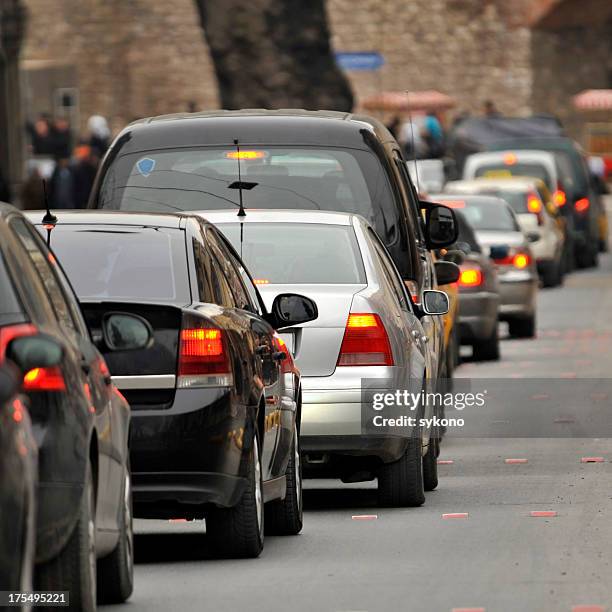city traffic - cars parked in a row stock pictures, royalty-free photos & images