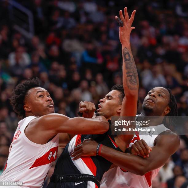 Toronto Raptors forward Scottie Barnes is called for a foul when he uses his forearm to move Portland Trail Blazers forward Toumani Camara from his...