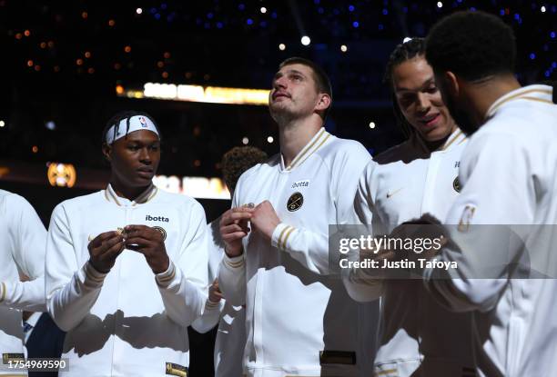 Nikola Jokic of the Denver Nuggets receives his championship ring before the game against the Los Angeles Lakers at Ball Arena on October 24, 2023 in...