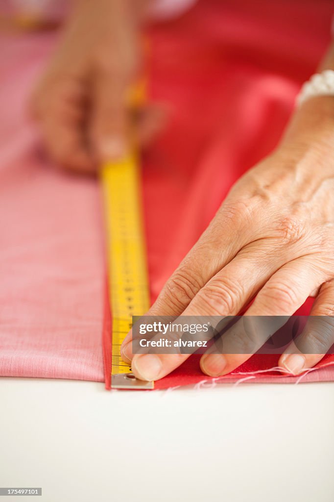 Person measuring cloth