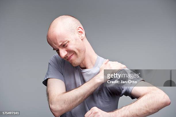 pain in shoulder - shoulder bone stock pictures, royalty-free photos & images