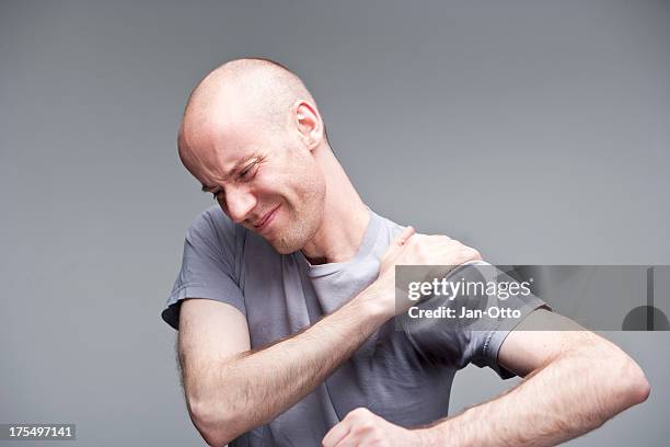 pain in shoulder - nerve impingement stock pictures, royalty-free photos & images