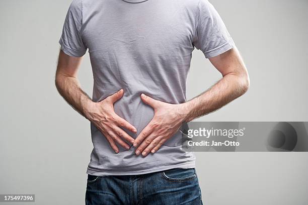 stomach ache - abdomen stock pictures, royalty-free photos & images