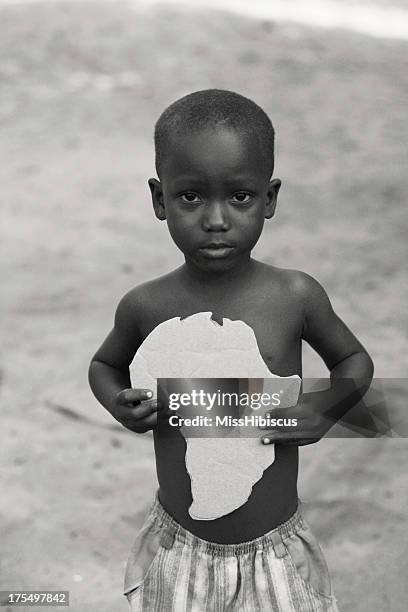 african boy with africa cut-out - miss sierra leone stock pictures, royalty-free photos & images