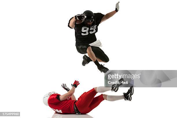 football players in action - tackling stock pictures, royalty-free photos & images