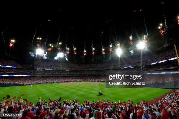 Philadelphia Phillies fans cheer as the team takes the field before Game Seven of the Championship Series before the game against the Arizona...