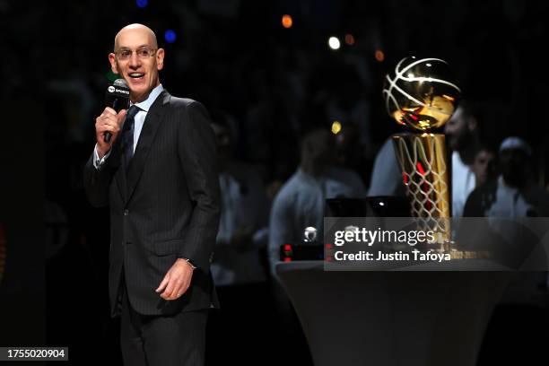 Commissioner Adam Silver speaks near the Larry O'Brien Trophy as the Denver Nuggets celebrate their championship with a banner raising and ring...