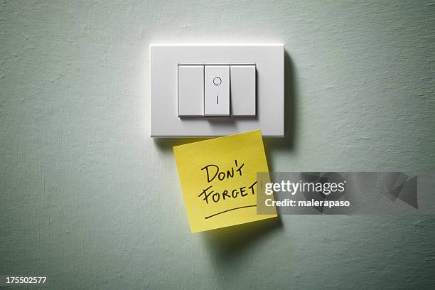 don't forget. light switch with yellow sticky note. - home bulletin board stock pictures, royalty-free photos & images