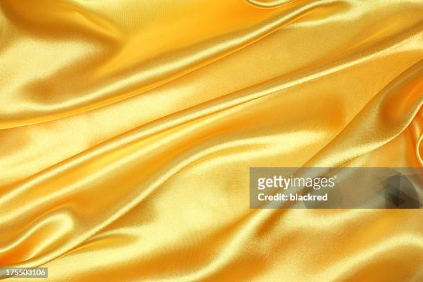 golden silk texture - silk stock pictures, royalty-free photos & images