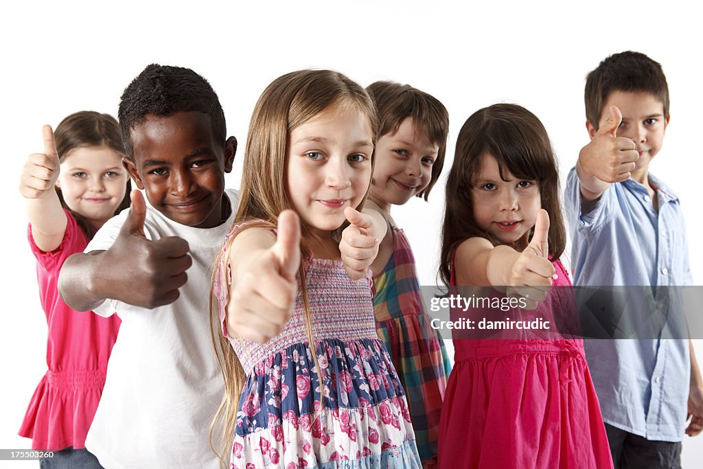 Group of multi ethnic children showing thumbs-up