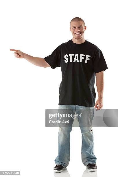 happy security guard pointing - handsome security guard stock pictures, royalty-free photos & images