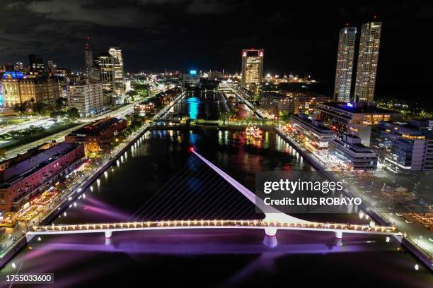 Aerial night view of the Puente de la Mujer in Puerto Madero, in Buenos Aires on October 30, 2023.