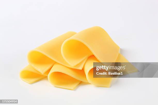 slices of cheese - piece stockfoto's en -beelden