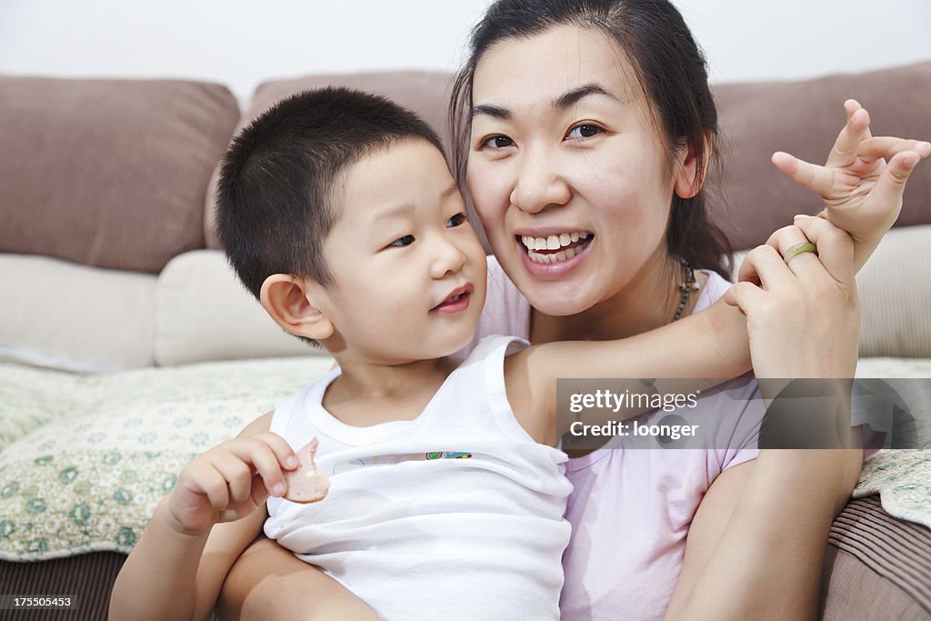 Mother and son having fun at home