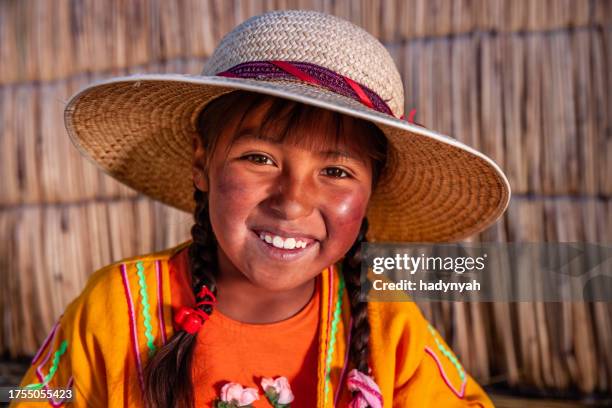 portrait of peruvian little girl on uros floating island, lake tititcaca - peruvian culture stock pictures, royalty-free photos & images