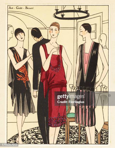 Women in evening dresses in crepe georgine at a glamorous party. Lithograph with pochoir handcolour from the luxury French fashion magazine 'Art,...