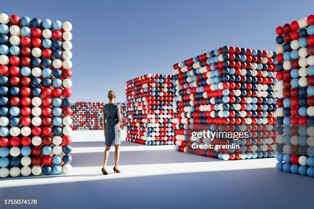 businesswoman walking in abstract maze - conceptual realism stock pictures, royalty-free photos & images