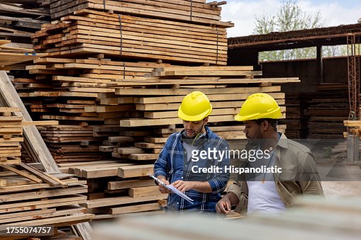 Team of employees working together at a lumberyard