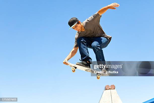 skateboarder in mid-air - skateboard park stock pictures, royalty-free photos & images