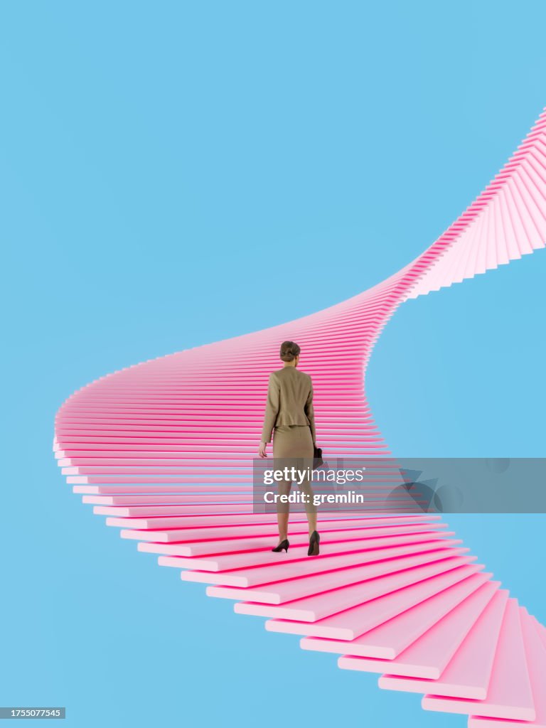 Businesswoman walking up the abstract stairs