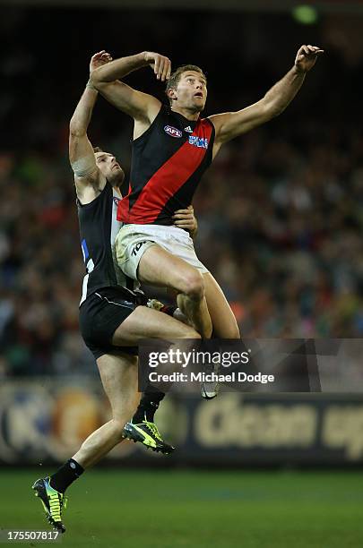 Nathan Brown of the Magpies and Tom Bellchambers of the Bombers contest for the ball during the round 19 AFL match between the Collingwood Magpies...