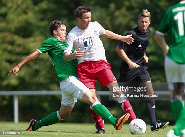 Theodor Bergmann of Erfurt and Philipp Eggersgluess of Bremen battle for the ball during the DFB Juniors Cup between FC Rot Weiss Erfurt and Werder...