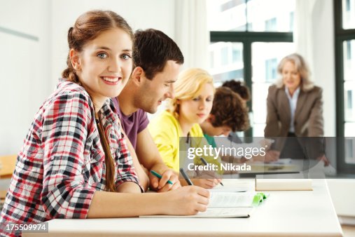 Students Completing Assignments In Classroom High-Res Stock Photo ...