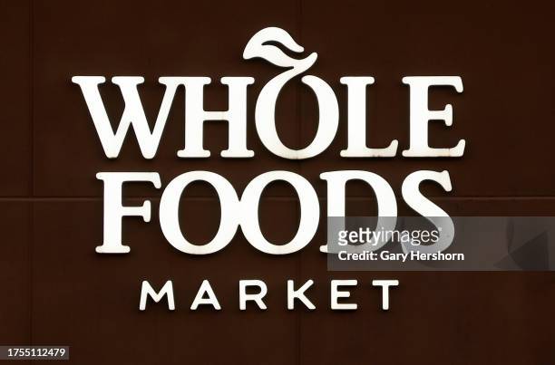 Corporate logo for Whole Foods Market hangs on the side of their grocery store on October 24 in Weehawken, New Jersey.
