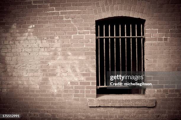 old brick wall - prison window stock pictures, royalty-free photos & images