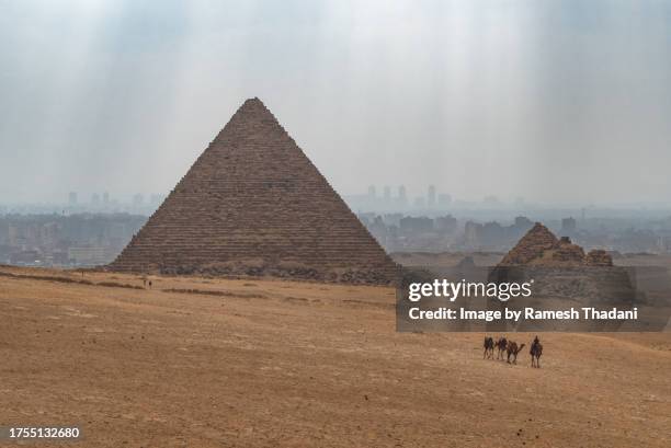 view of the pyramid of menkaure on a hazy day - limestone pyramids stock pictures, royalty-free photos & images