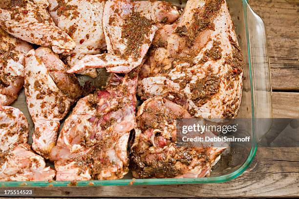 marinating jerk chicken - chicken thighs stock pictures, royalty-free photos & images