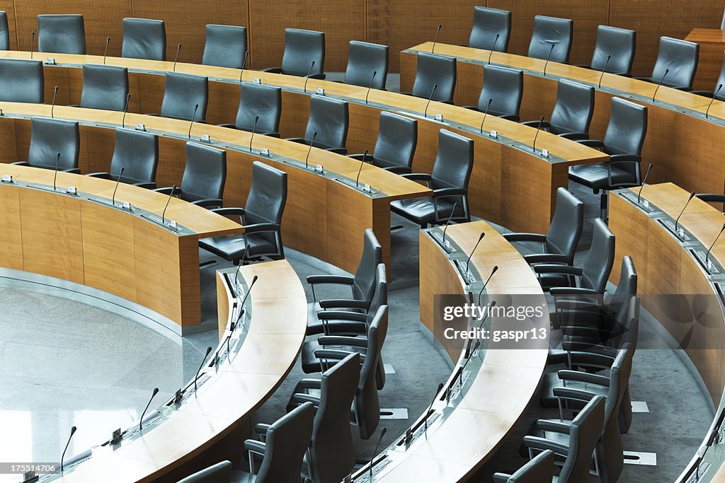 Oval conference room with rows of seats
