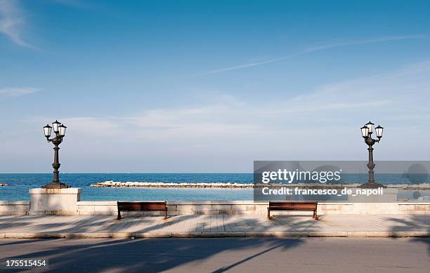 bari, promenade with bench and lamppost. apulia - italy - bari stockfoto's en -beelden