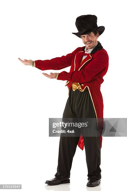 portrait of a happy ring master gesturing - ringmaster stock pictures, royalty-free photos & images