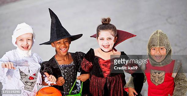 children in halloween costumes - stage costume stock pictures, royalty-free photos & images