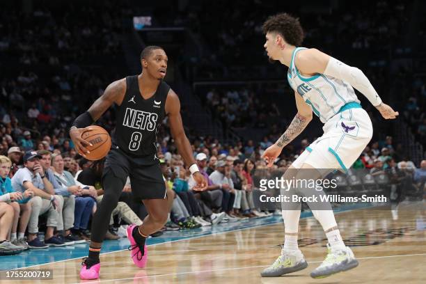 Lonnie Walker IV of the Brooklyn Nets handles the ball during the game against the Charlotte Hornets on October 30, 2023 at Spectrum Center in...