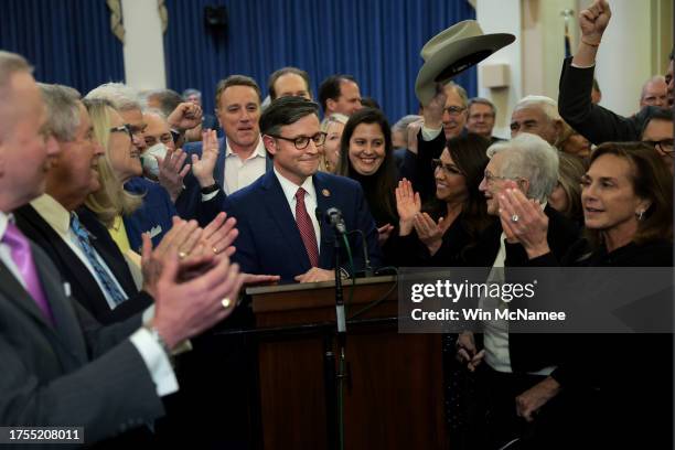 Rep. Mike Johnson is applauded by House Republicans after he was elected as the speaker nominee during a GOP conference meeting in the Longworth...