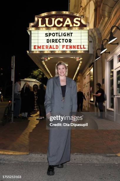 Emerald Fennell poses in front of the marquee at the gala screening of "Saltburn" and the Spotlight Director Award Presentation to Emerald Fennell...