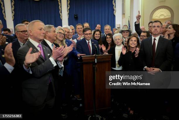 Rep. Mike Johnson surrounded by House Republicans speaks after being elected as the speaker nominee during a GOP conference meeting in the Longworth...