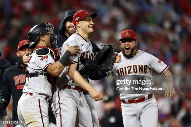 Paul Sewald of the Arizona Diamondbacks celebrates with teammates after beating the Philadelphia Phillies 4-2 in Game Seven of the Championship...