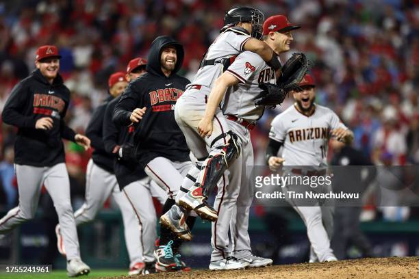 Paul Sewald of the Arizona Diamondbacks celebrates with teammates after beating the Philadelphia Phillies 4-2 in Game Seven of the Championship...